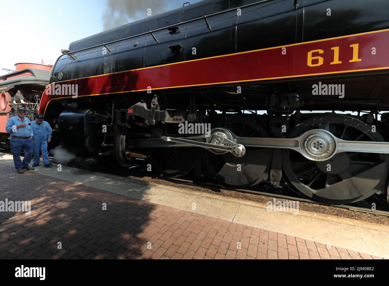 A steam engine with an engineer and a fireman Stock Photo - Alamy