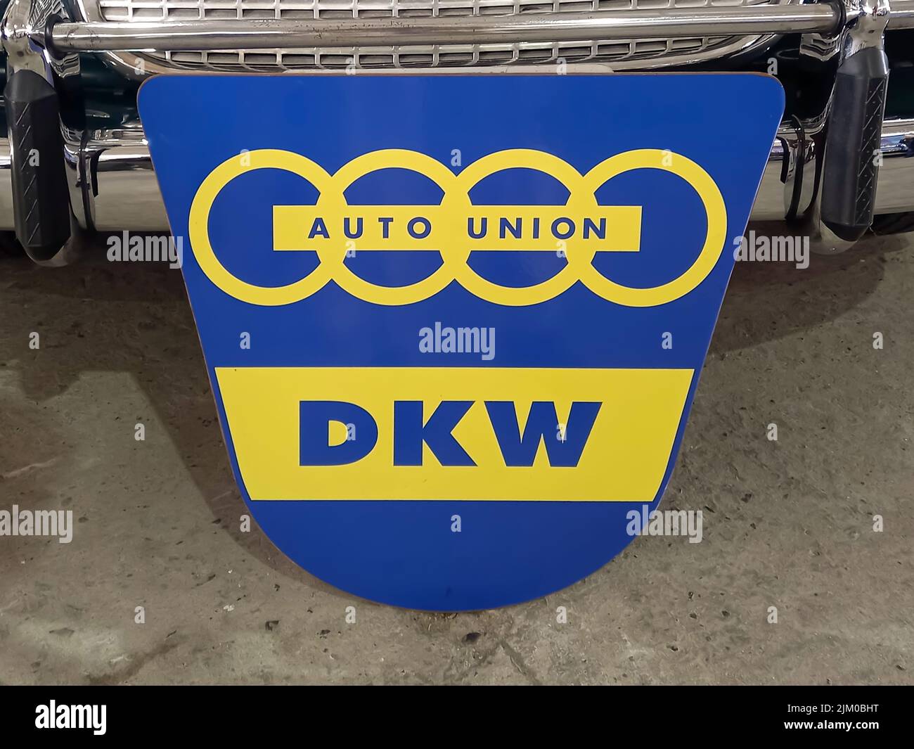 Avellaneda, Argentina - Apr 3, 2022: Old blue and yellow Auto Union DKW sign emblem logo and branding 1960s. Stock Photo