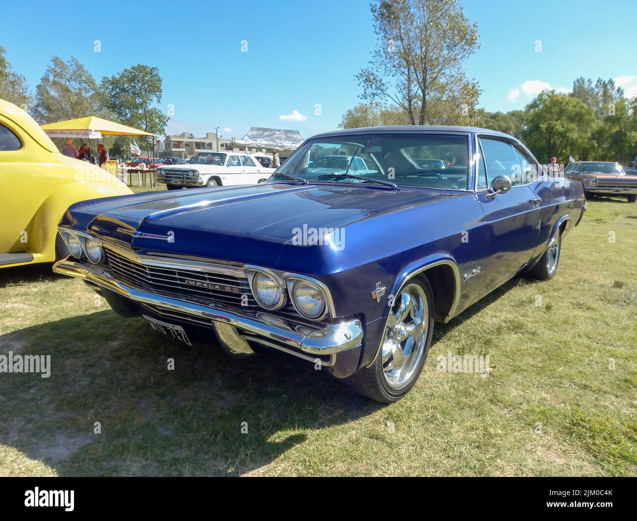 Chascomus, Argentina - Apr 09, 2022: old popular blue Chevrolet Chevy Impala SS Super Sport V8 327 two door hardtop coupe 1964 by GM in the countrysid Stock Photo