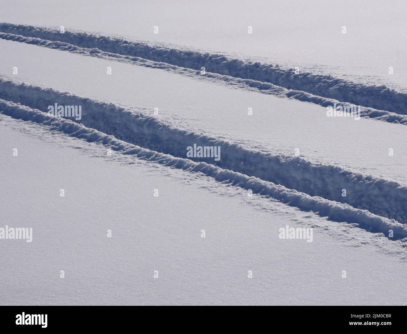 track of a car in deep snow Stock Photo