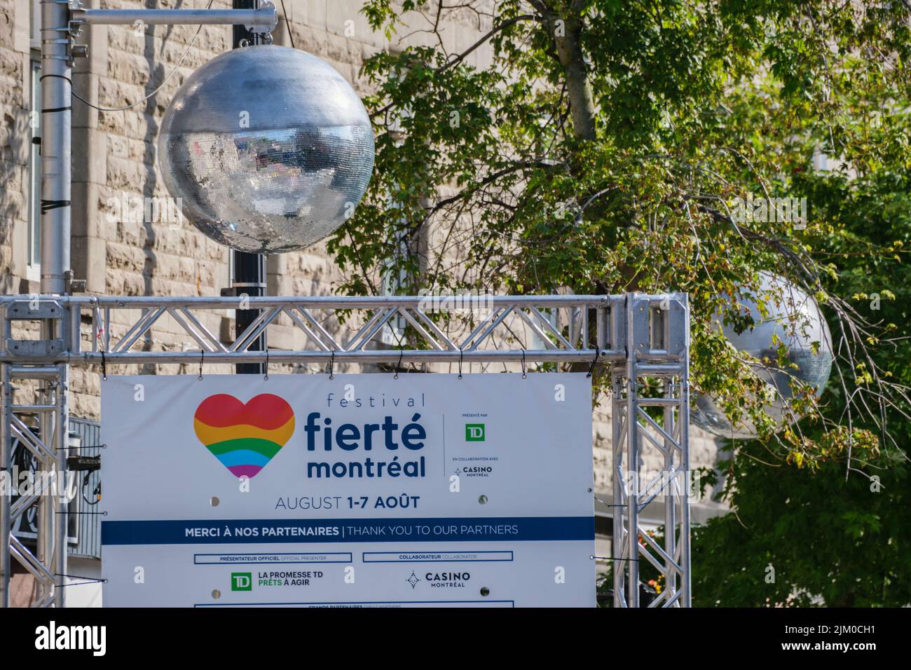 Montreal, CA - 4 August 2022: Disco ball and sign for Montreal pride week 'Fierté Montreal' Stock Photo