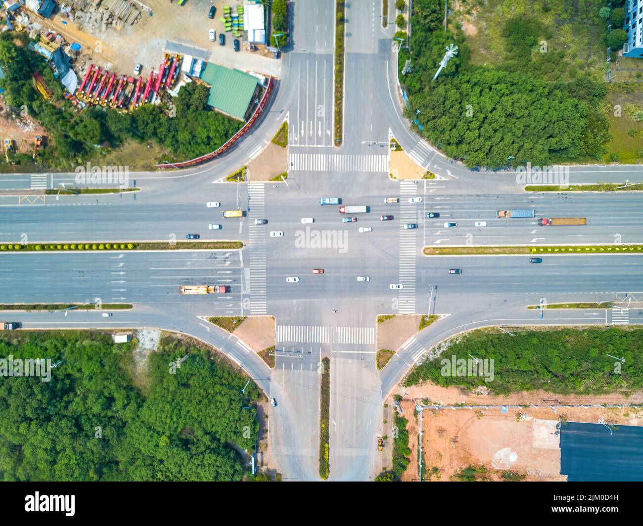 Aerial shot of road intersection in urban industrial area Stock Photo ...