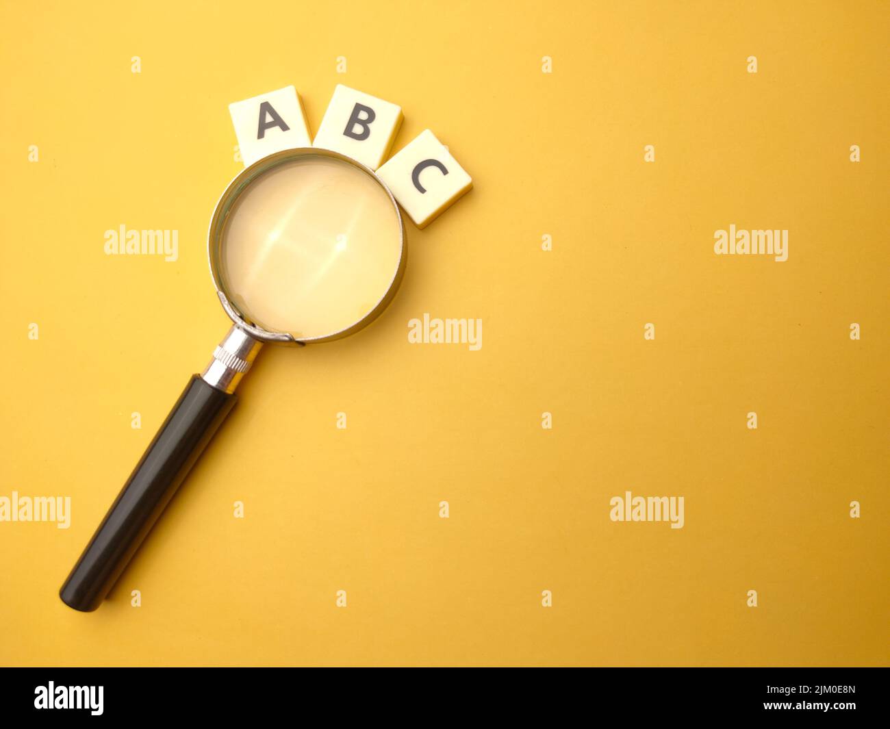 mangnifying-glass-and-toys-word-with-the-word-abc-education-concept