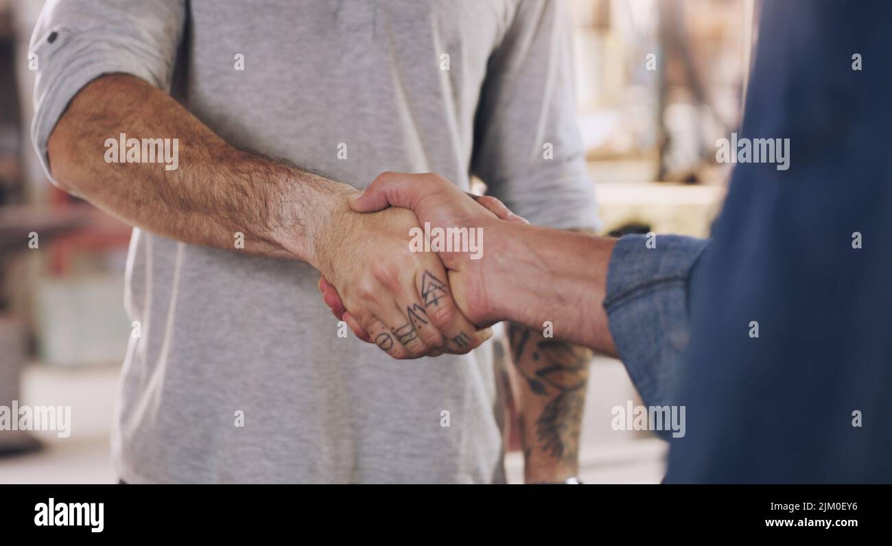 We can pull this off if we work together. two men shaking hands in a Stock Photo Alamy