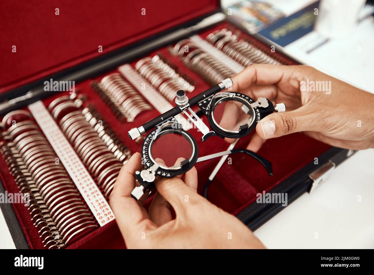 Clear vision coming right up. an unrecognisable optometrist choosing