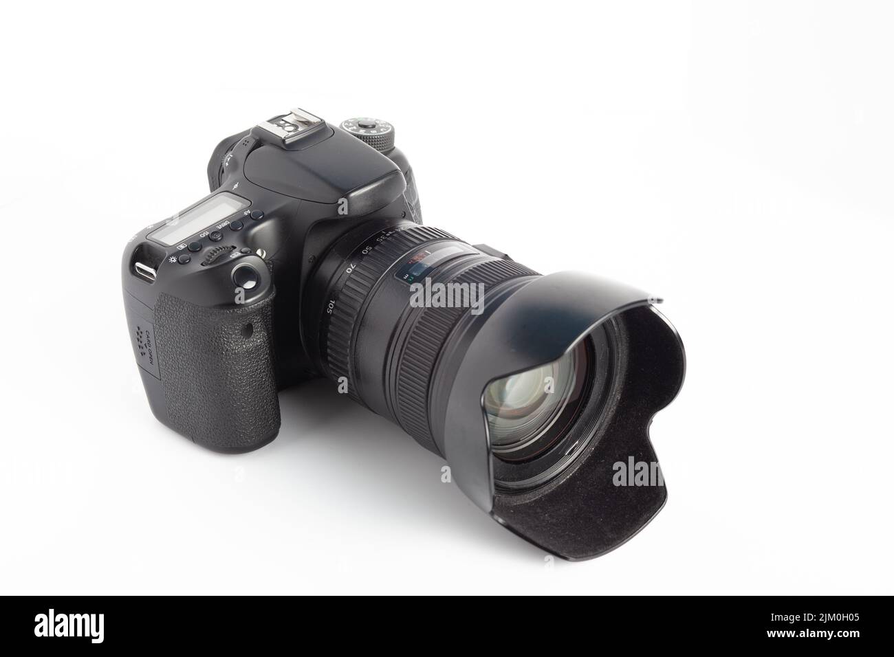 A closeup of a camera on a white surface Stock Photo