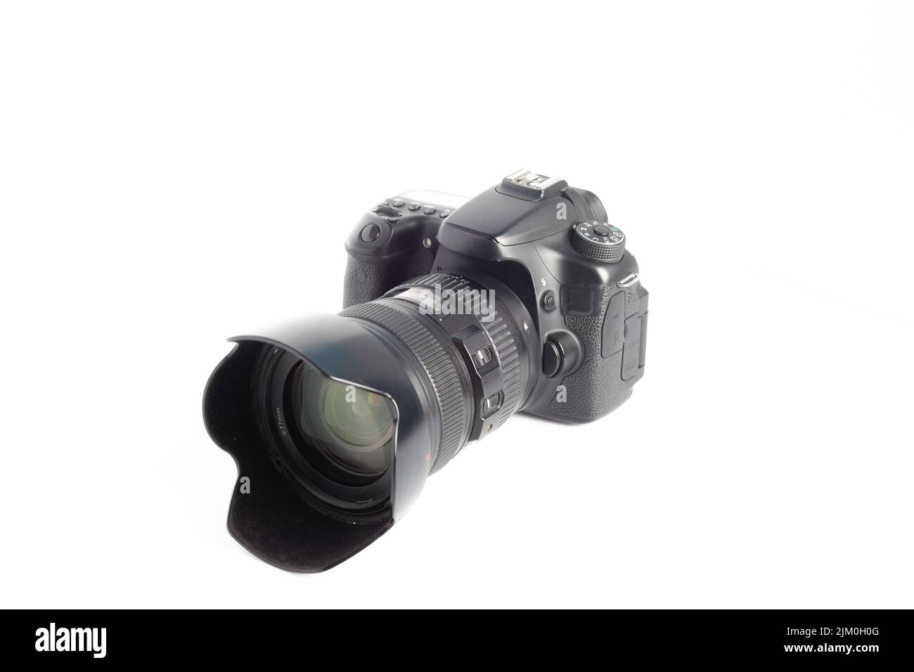 A closeup of a camera on a white surface Stock Photo