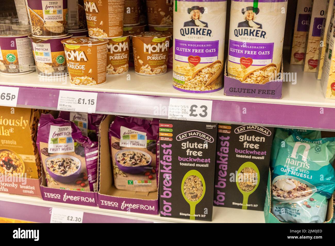 Gluten free foods in an English supermarket, gluten free Quaker Oats, gluten free buckwheat meusli,UK,summer 2022 Stock Photo