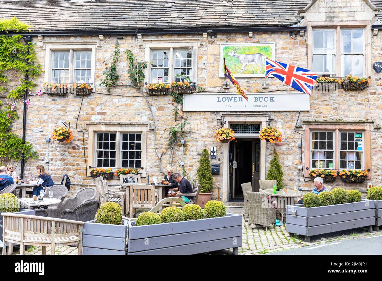 Waddington village in Lancashire , Lower Buck Inn public house pub, on a summers day in 2022, England,UK customers eating drinking outside Stock Photo