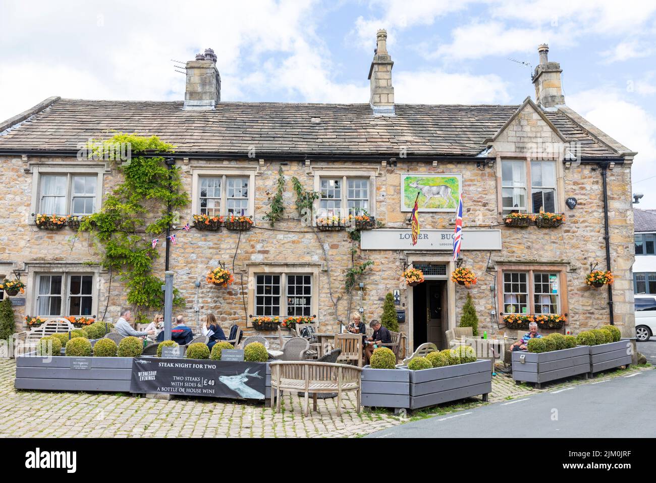 Waddington village in Lancashire , Lower Buck Inn public house pub, on a summers day in 2022, England,UK customers eating drinking outside Stock Photo