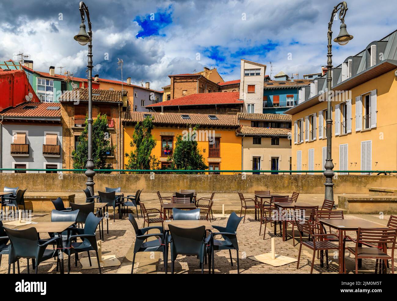 Tables at one of many outdoor cafes in Casco Viejo, the historic Old Town Pamplona, Spain famous for running of the bulls Stock Photo