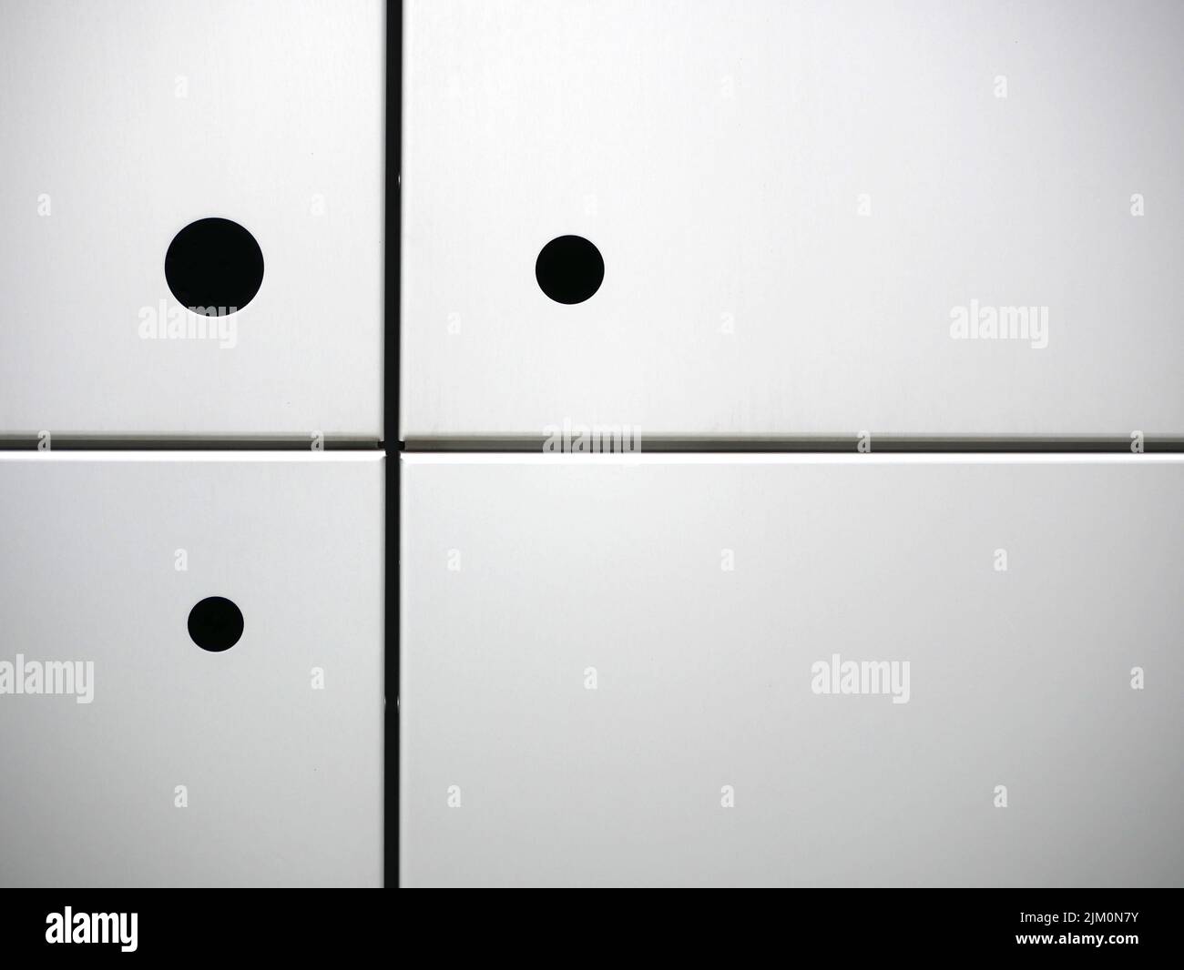 Three black circles on four white squares Stock Photo