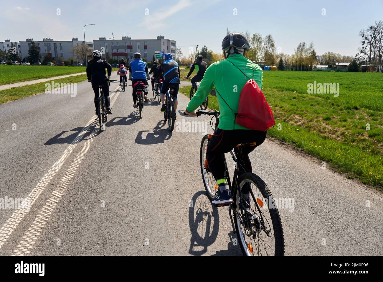 A group of people riding bicycles on an asphalt footpath during a bike ...