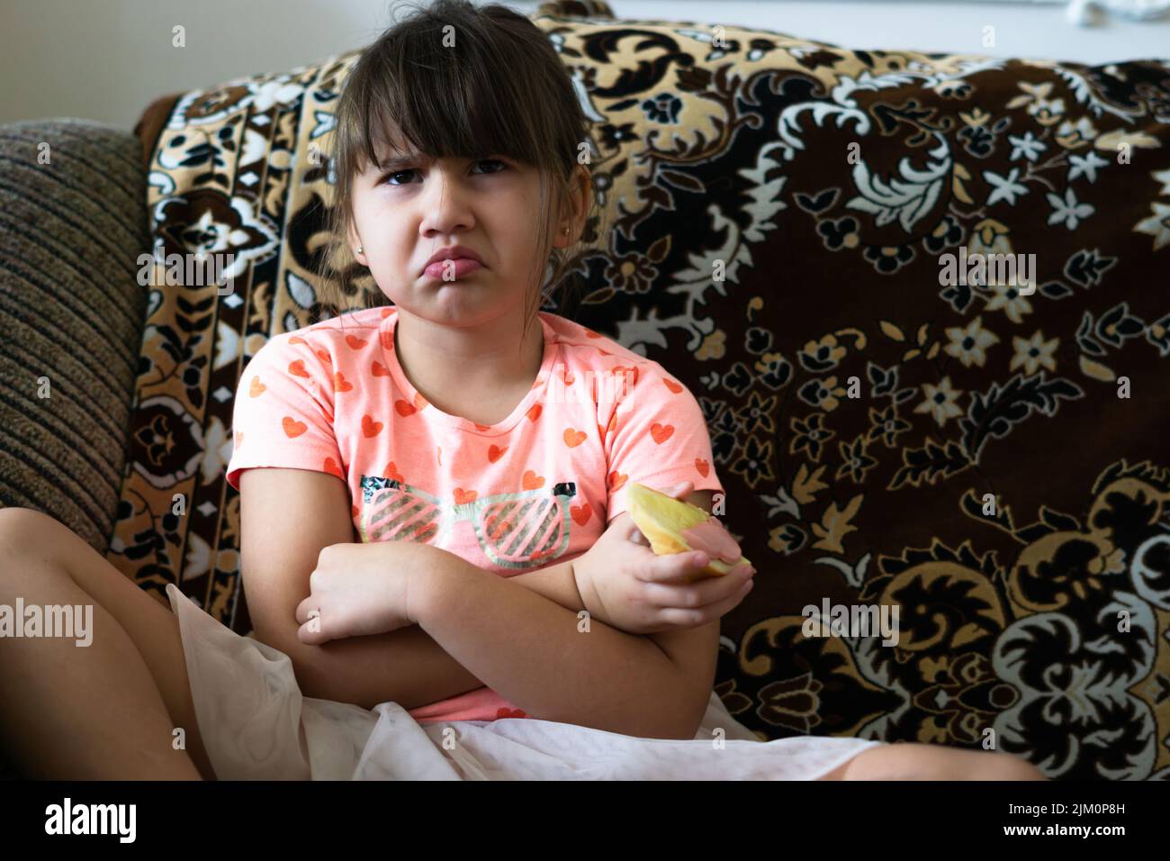 A close up child holding a pumpkin Stock Photo