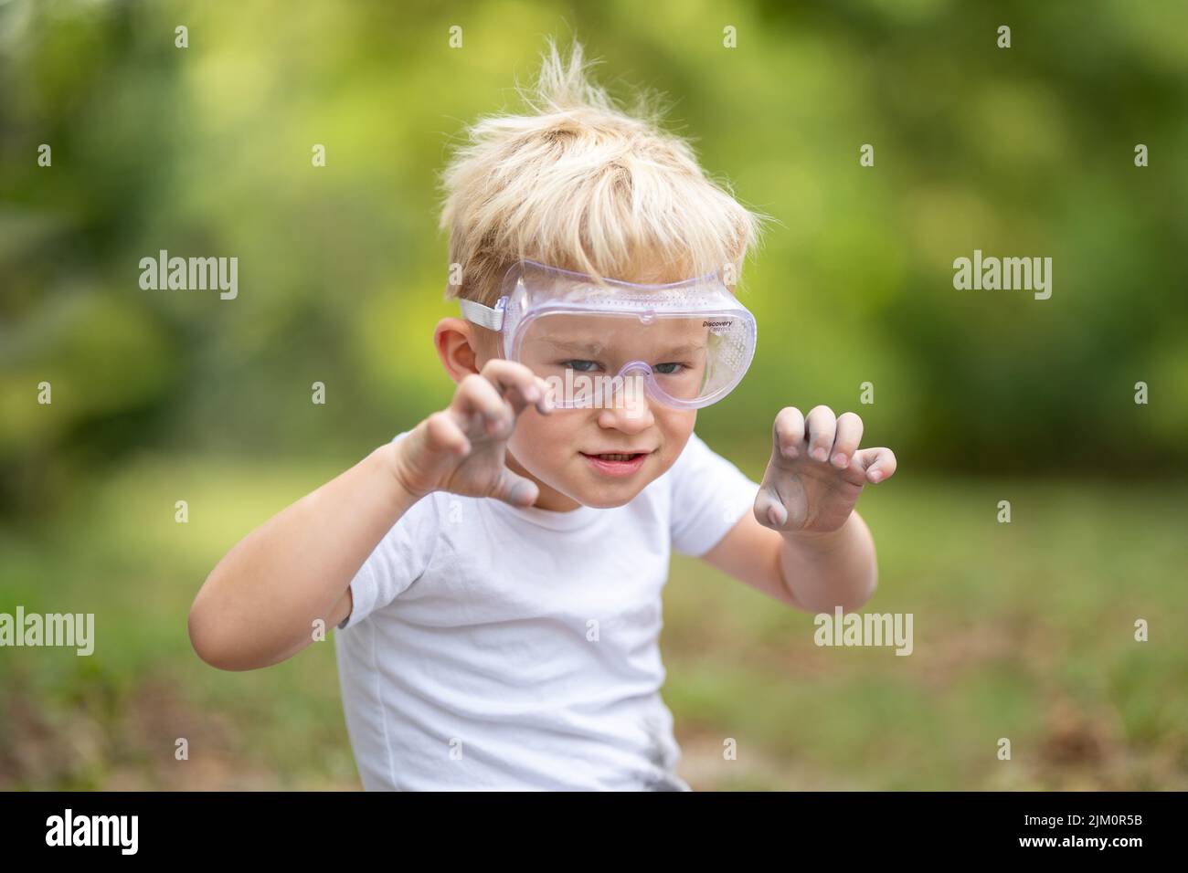 Boy playing in safety goggles Stock Photo