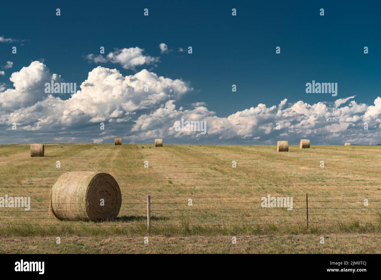 Haystacks in field clouds hi-res stock photography and images - Alamy