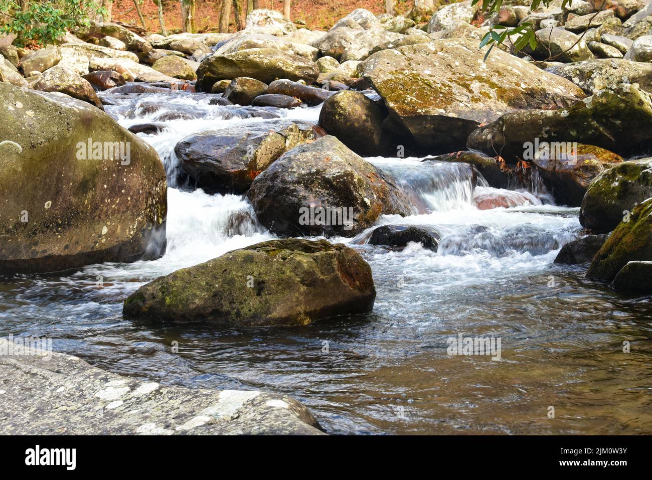 A beautiful view of rocks in a flowing river Stock Photo