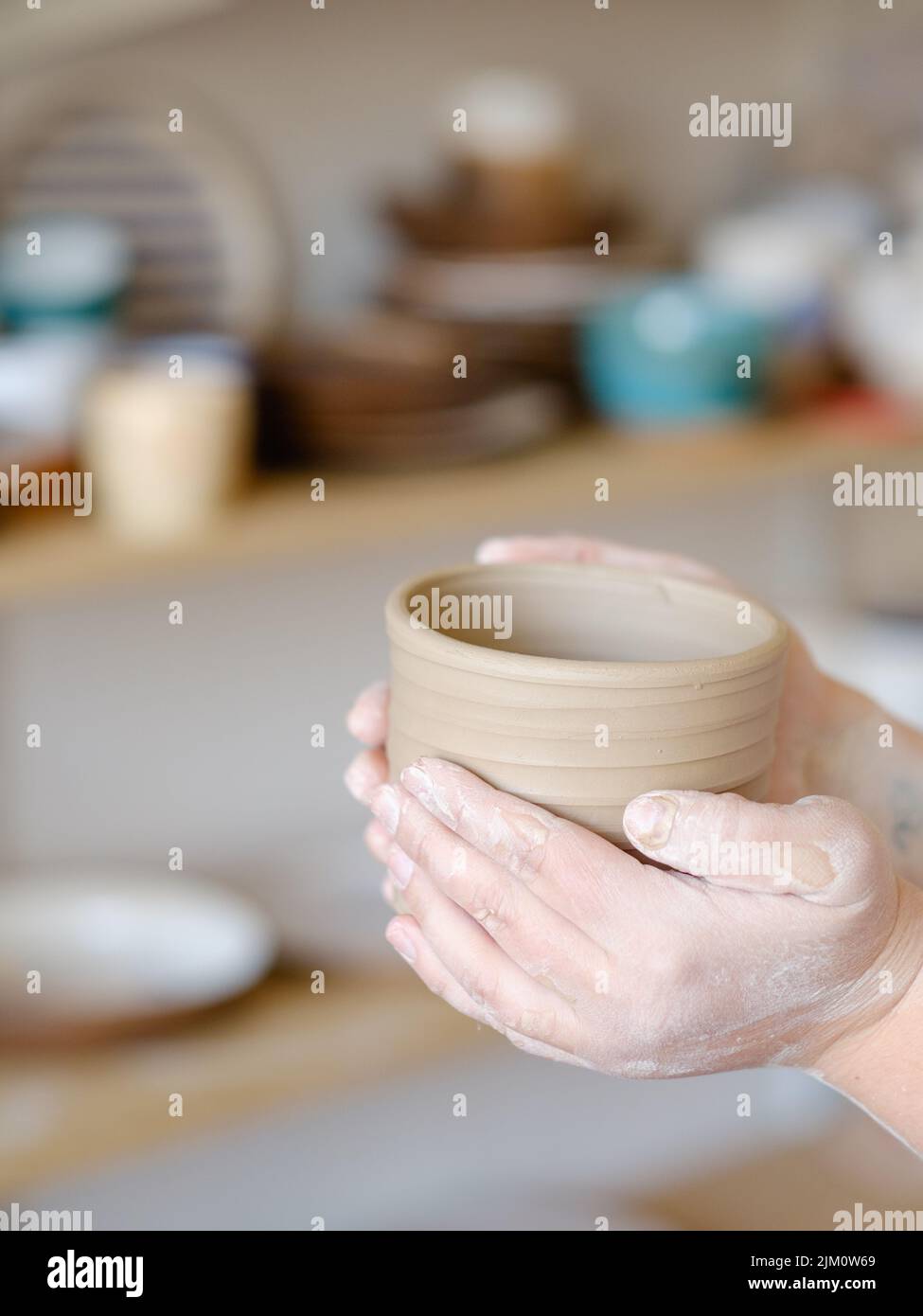 pottery skill traditional hold clay jug crockery Stock Photo Alamy