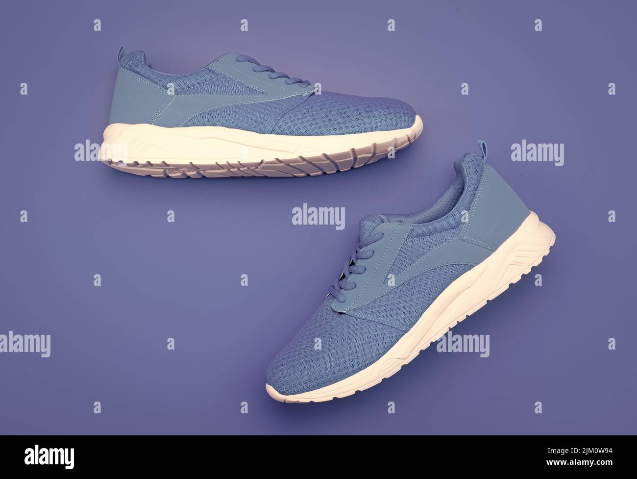 shoes on blue background. shoe store. shopping concept. footwear for training. Stock Photo