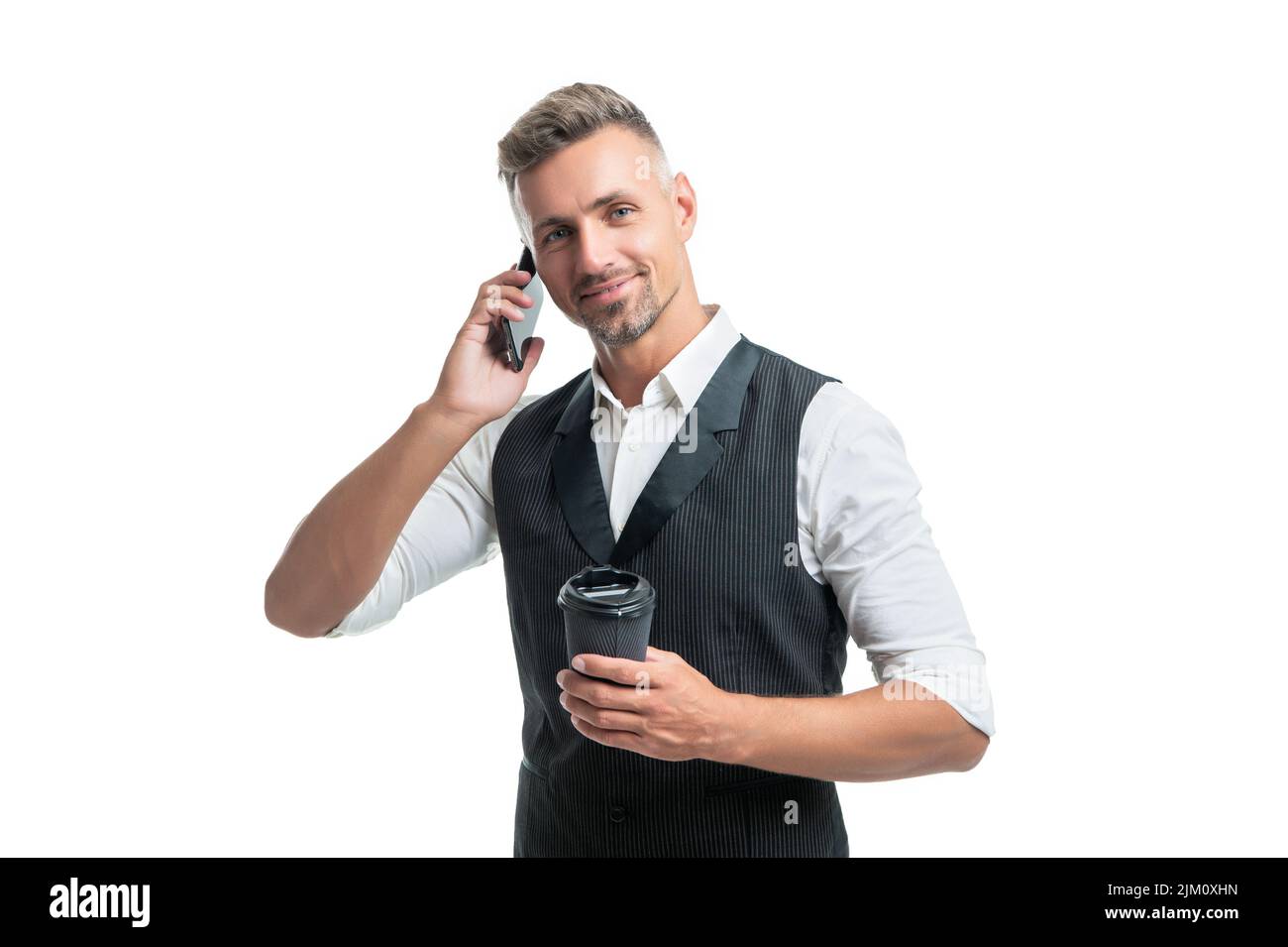 Happy businessman talking on mobile phone during coffee break isolated on white Stock Photo