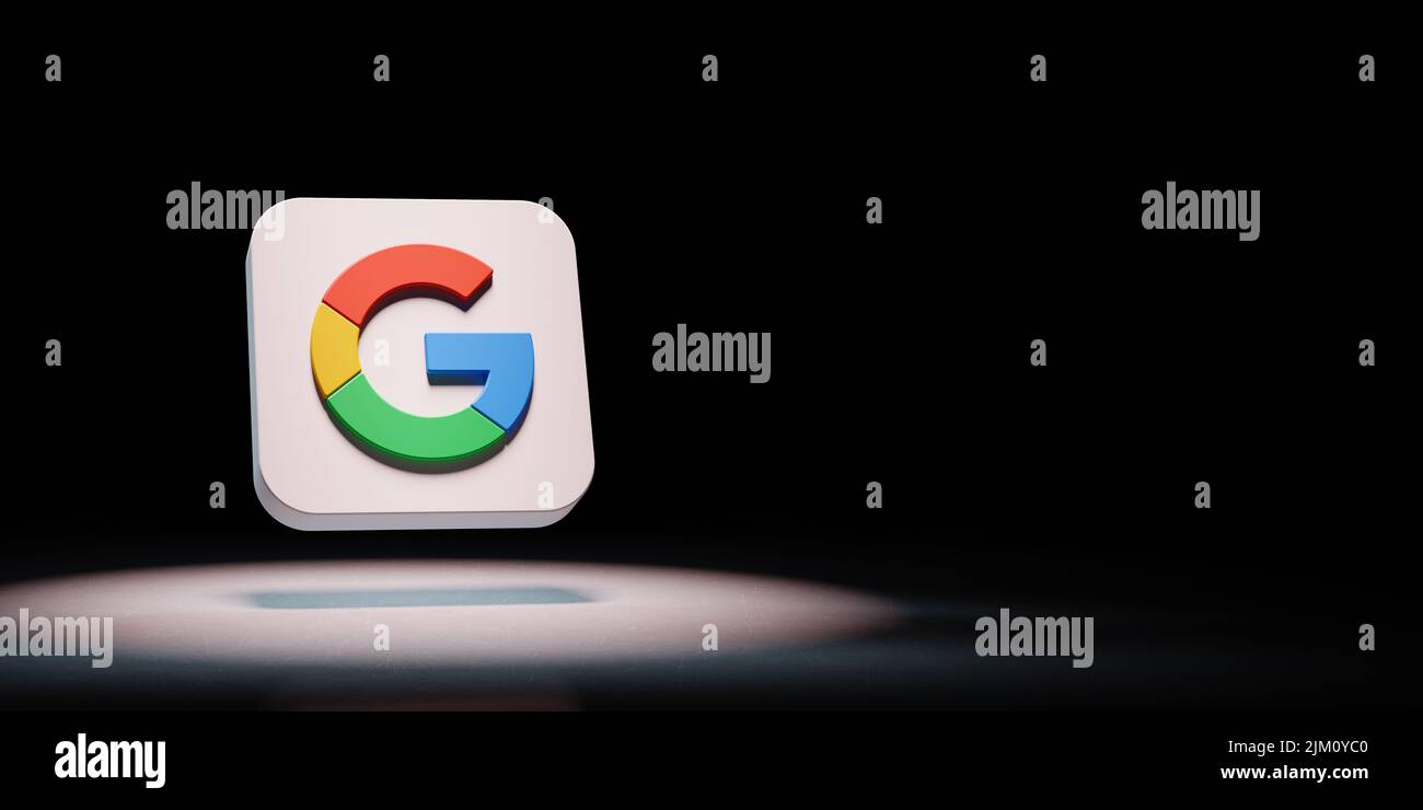 Google G App Icon Spotlighted on Black Background Stock Photo
