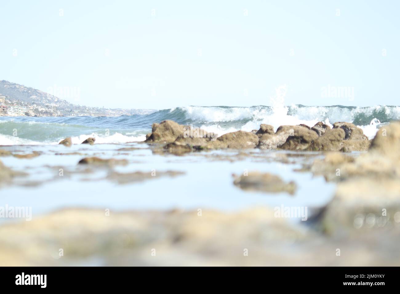 A selective of sea waves on a stony beach Stock Photo