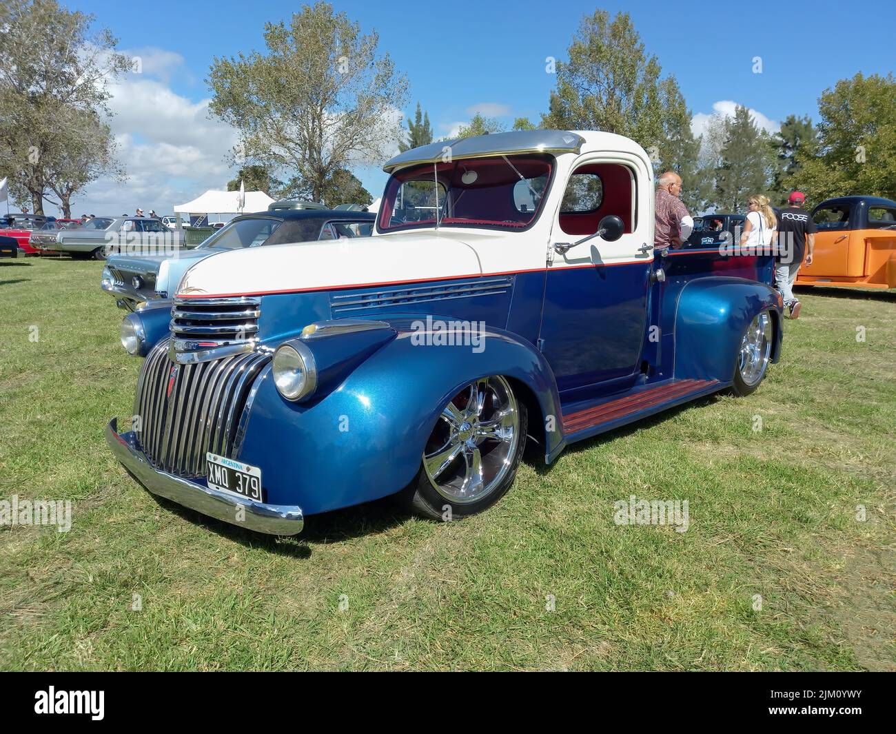 Chascomus, Argentina - Apr 09, 2022: Old blue utility pickup truck Chevrolet Chevy 3100 1940s by General Motors in the countryside. Nature grass trees Stock Photo