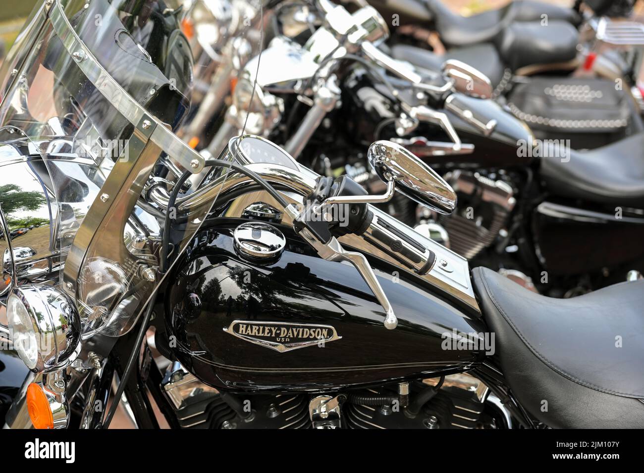 Ratzeburg, Germany, July 31, 2022: Harley Davidson motorcycles with shiny black pain and chrome, legendary vehicle with cult status, selected focus on Stock Photo