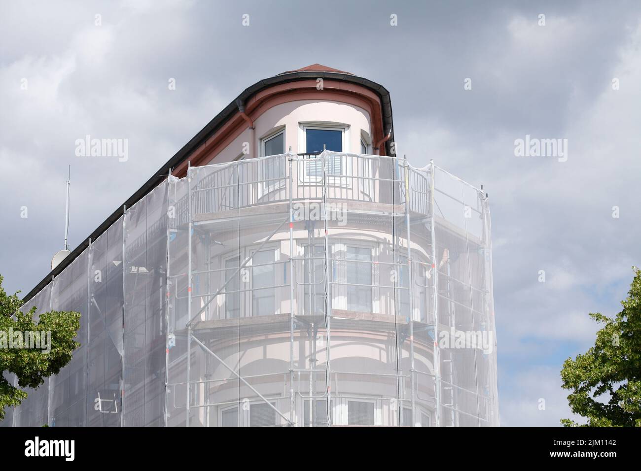 tarpaulin, construction site, scaffolding, house facade, Germany Stock Photo