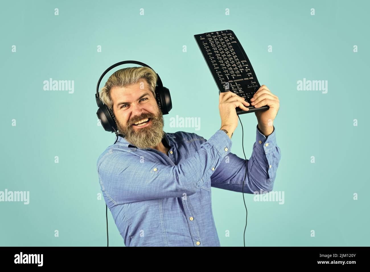 hacker typing. communication concept. support, call center and customer service help desk. gamer playing computer game. Digital Music Creation. angry Stock Photo