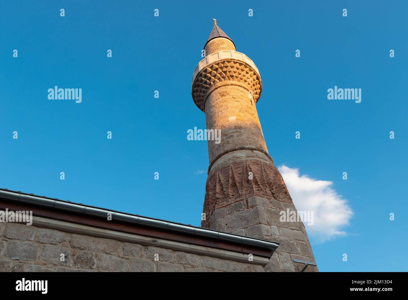 The muezzin call for evening prayer is heard from the minaret of the mosque. Islamic religion and traditional holidays concept Stock Photo