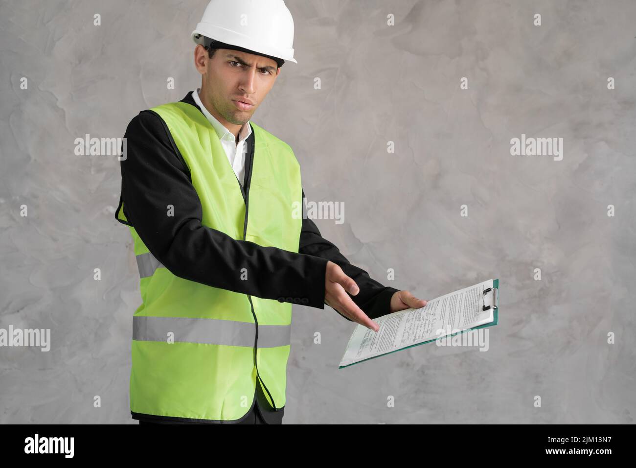 Muslim young architect inspector man wearing builder safety helmet and ...