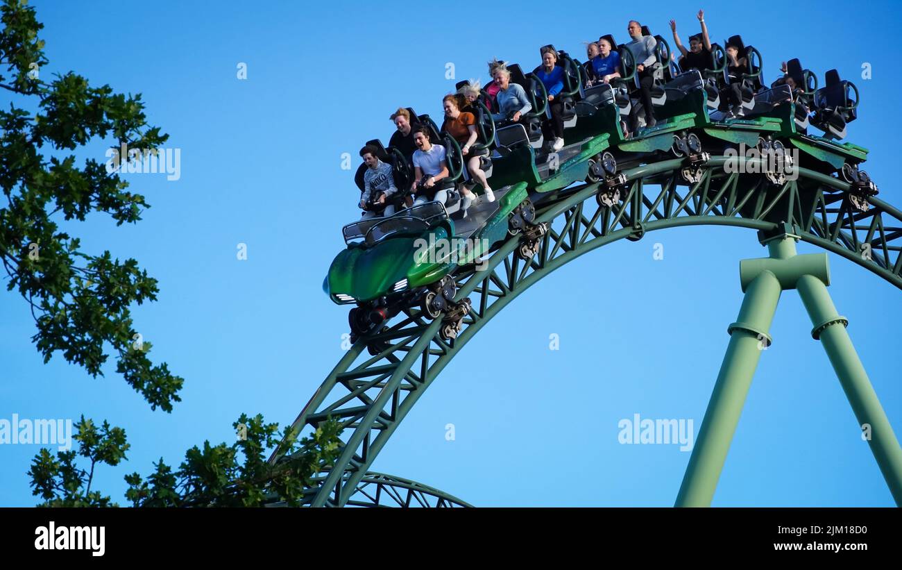 Gothenburg, Sweden - Young People screaming during a ride at Liseberg roller coaster 'Helix' Stock Photo