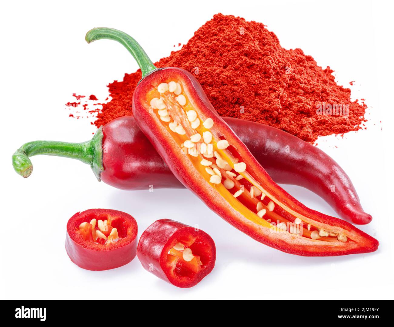 Fresh red chilli peppers, cross section of chilli pepper and ground cayenne pepper with seeds isolated on white background. Stock Photo