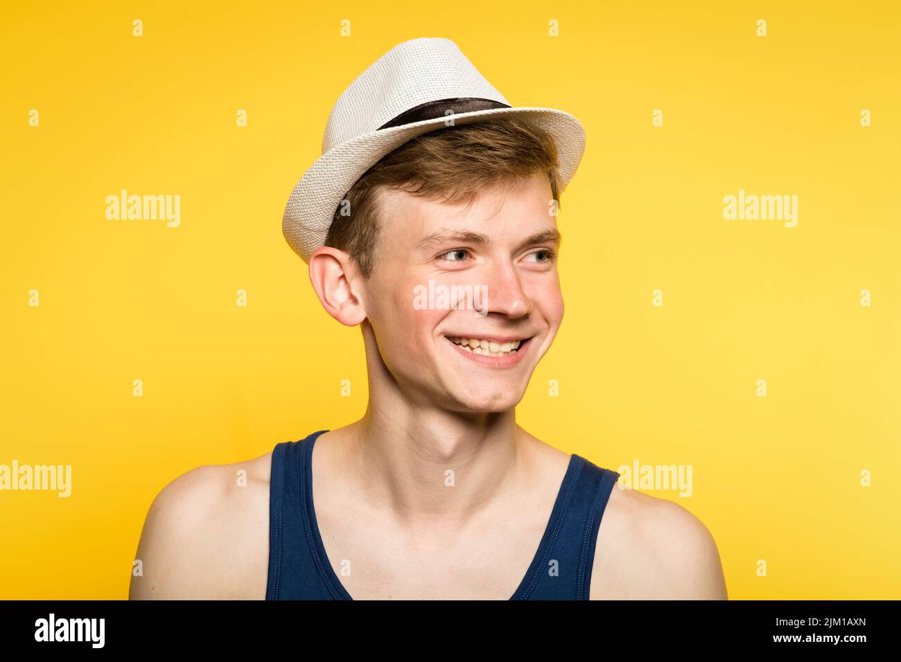 cute smiling handsome young man tank top fedora Stock Photo