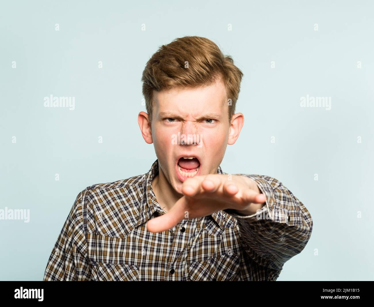 rays hatred frightening angry man reach out hand Stock Photo