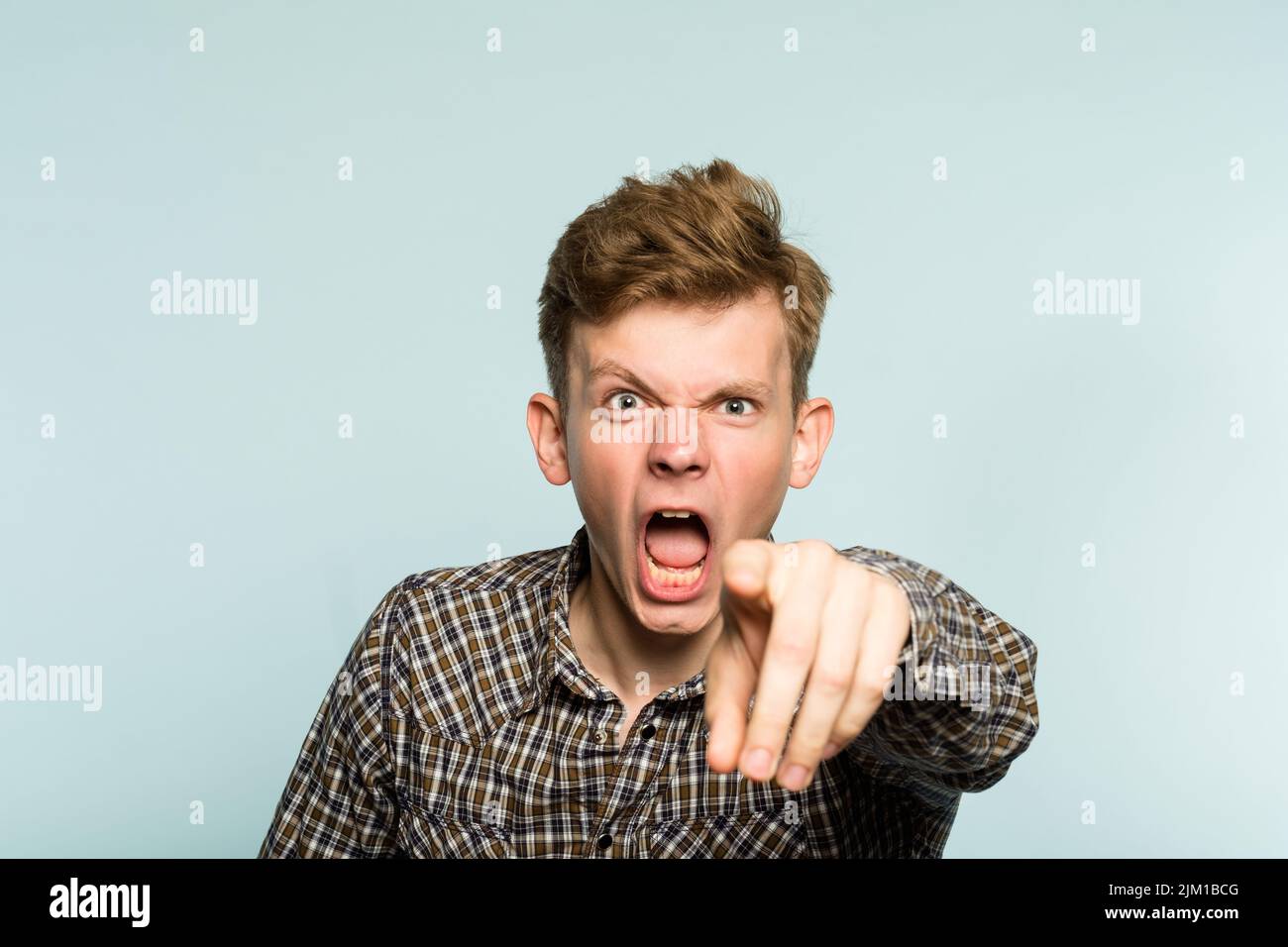 angry mental man scream point crazy berserk person Stock Photo