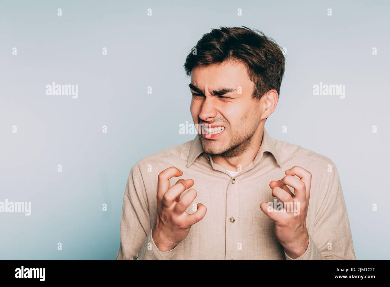 uncontrollable anger helplessness despair man face Stock Photo