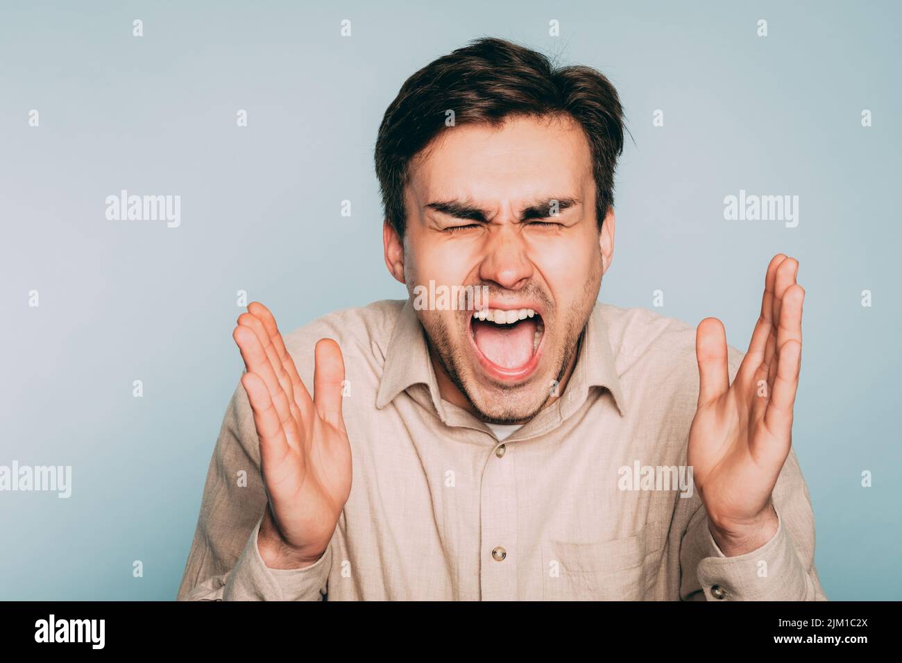 man screaming feelings overload fury emotion Stock Photo