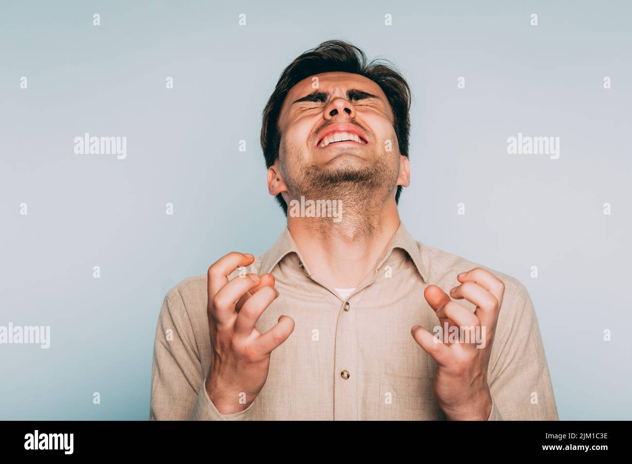 uncontrollable anger helplessness despair man face Stock Photo