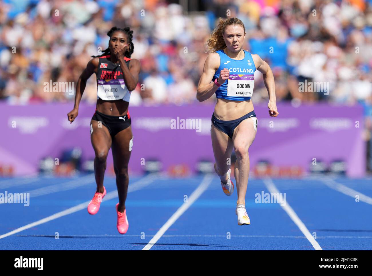 Scotland's Beth Dobbin (right) in action during the fifth heat of round one of the Women's 100 metres at Alexander Stadium on day seven of the 2022 Commonwealth Games in Birmingham. Picture date: Thursday August 4, 2022. Stock Photo