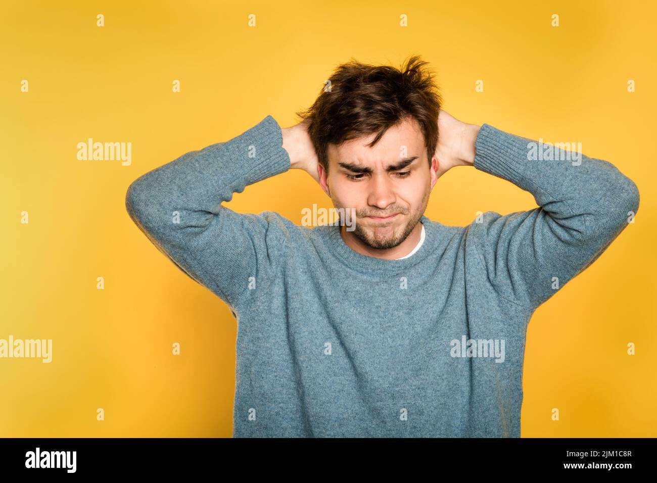 annoyed discontent frustrated disgruntled man Stock Photo
