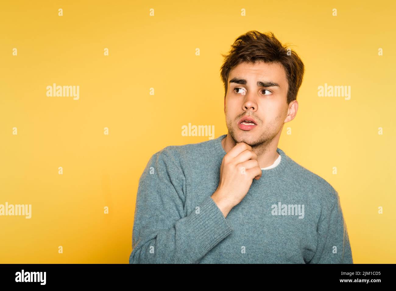 puzzled confused man scratch beard thinking Stock Photo