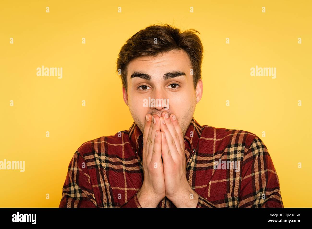 amazed shocked gobsmacked man cover mouth emotion Stock Photo Alamy