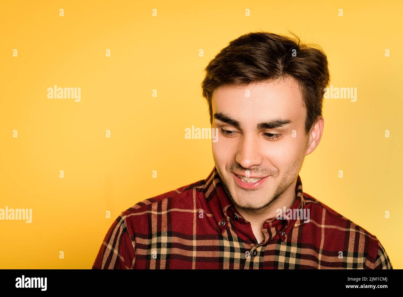 smiling mysterious man looking sideways emotion Stock Photo