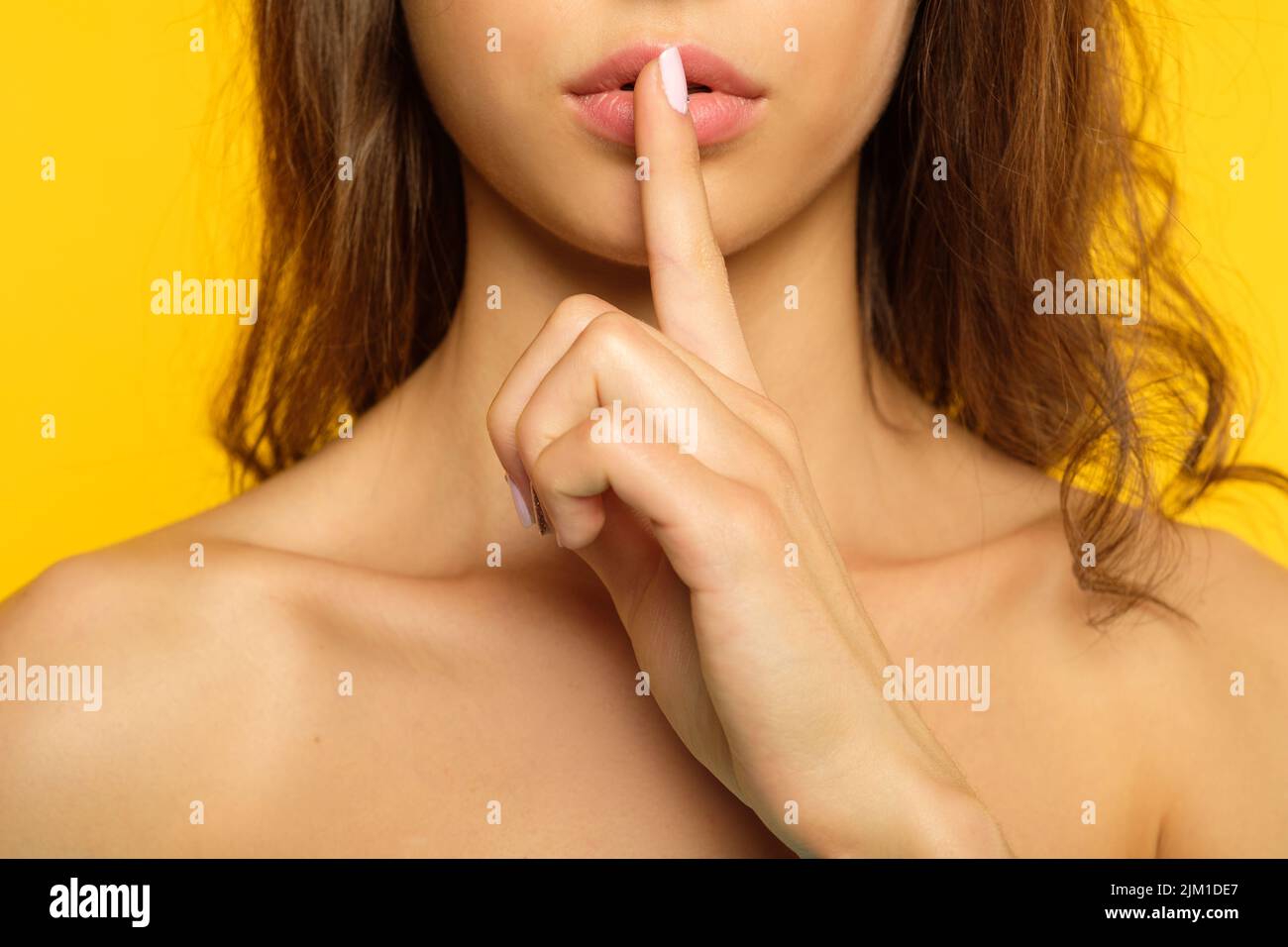 girl keep secret mystery finger on lips Stock Photo
