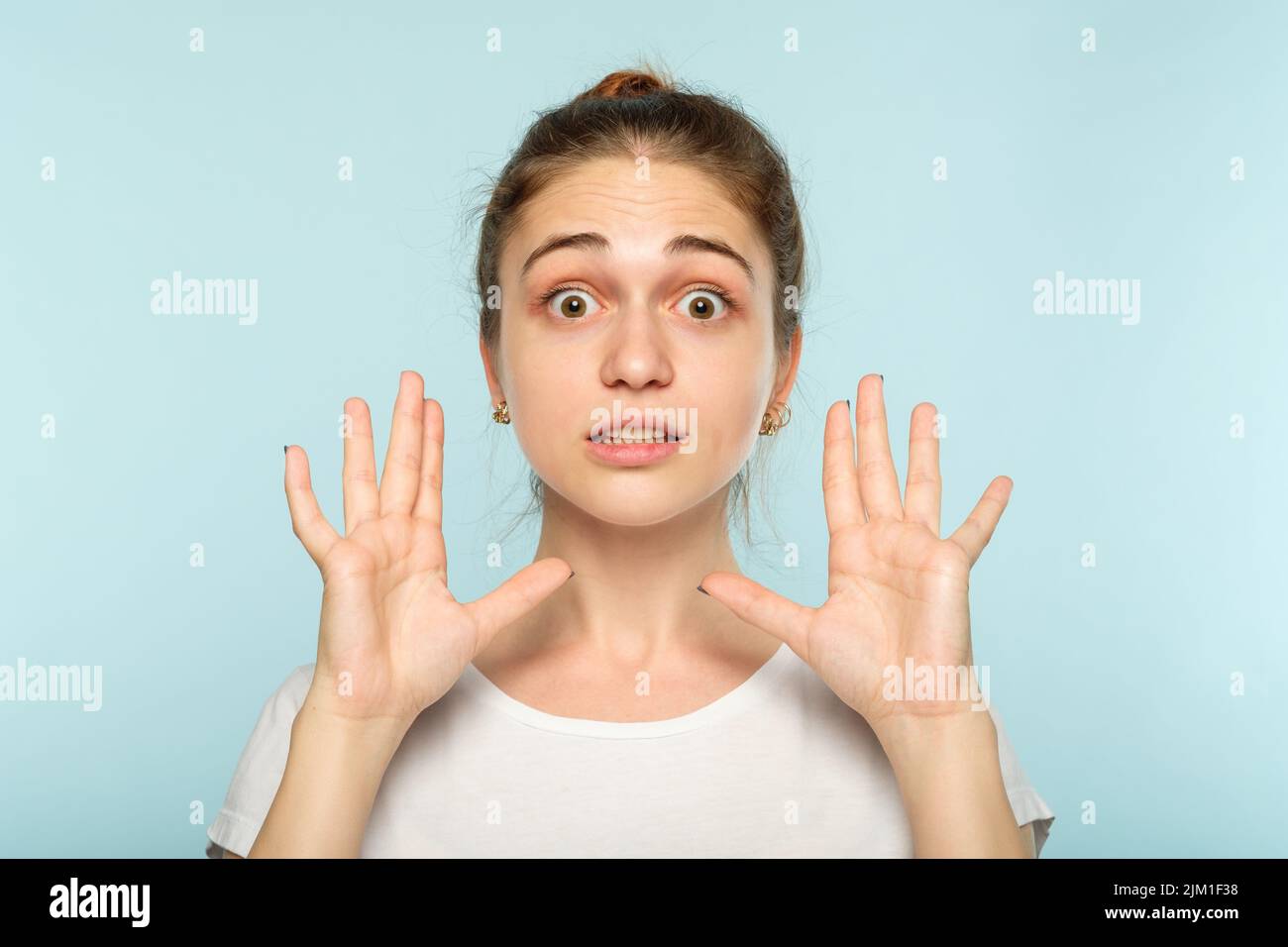 big size surprised astonished girl dimension hands Stock Photo