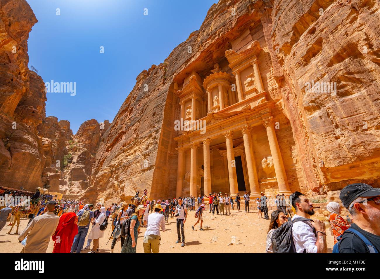 Crowds looking at the Treasury building from in Petra Jordan. Stock Photo