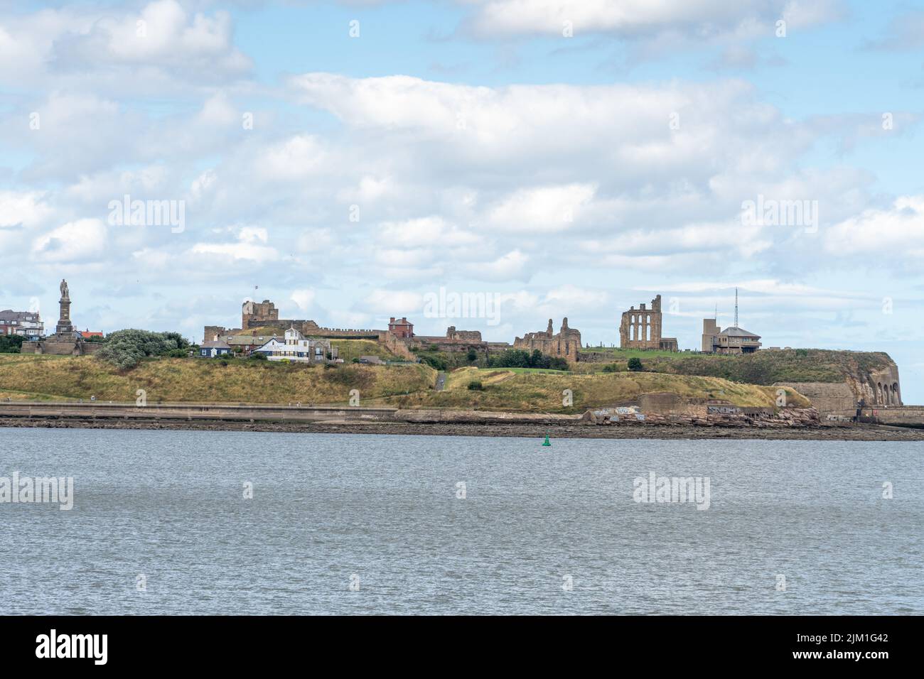 A riverscape view of Tynemouth Priory and castle and the Collingwood Monument in Tynemouth, North Tyneside, UK. Stock Photo