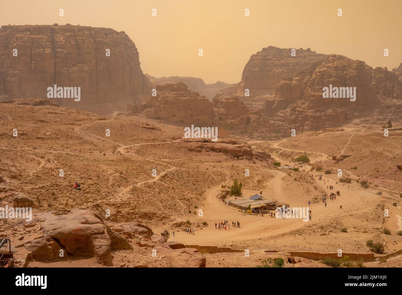 Looking down from the royal Tombs in a dust storm in Petra. Stock Photo